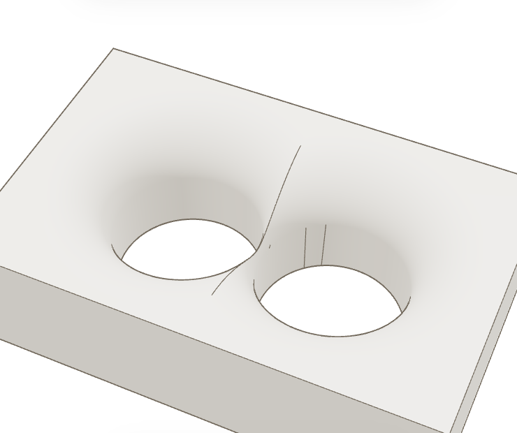 Two requested six-millimeter bore-mouth rounds form one broad top opening while the deeper bore walls remain.